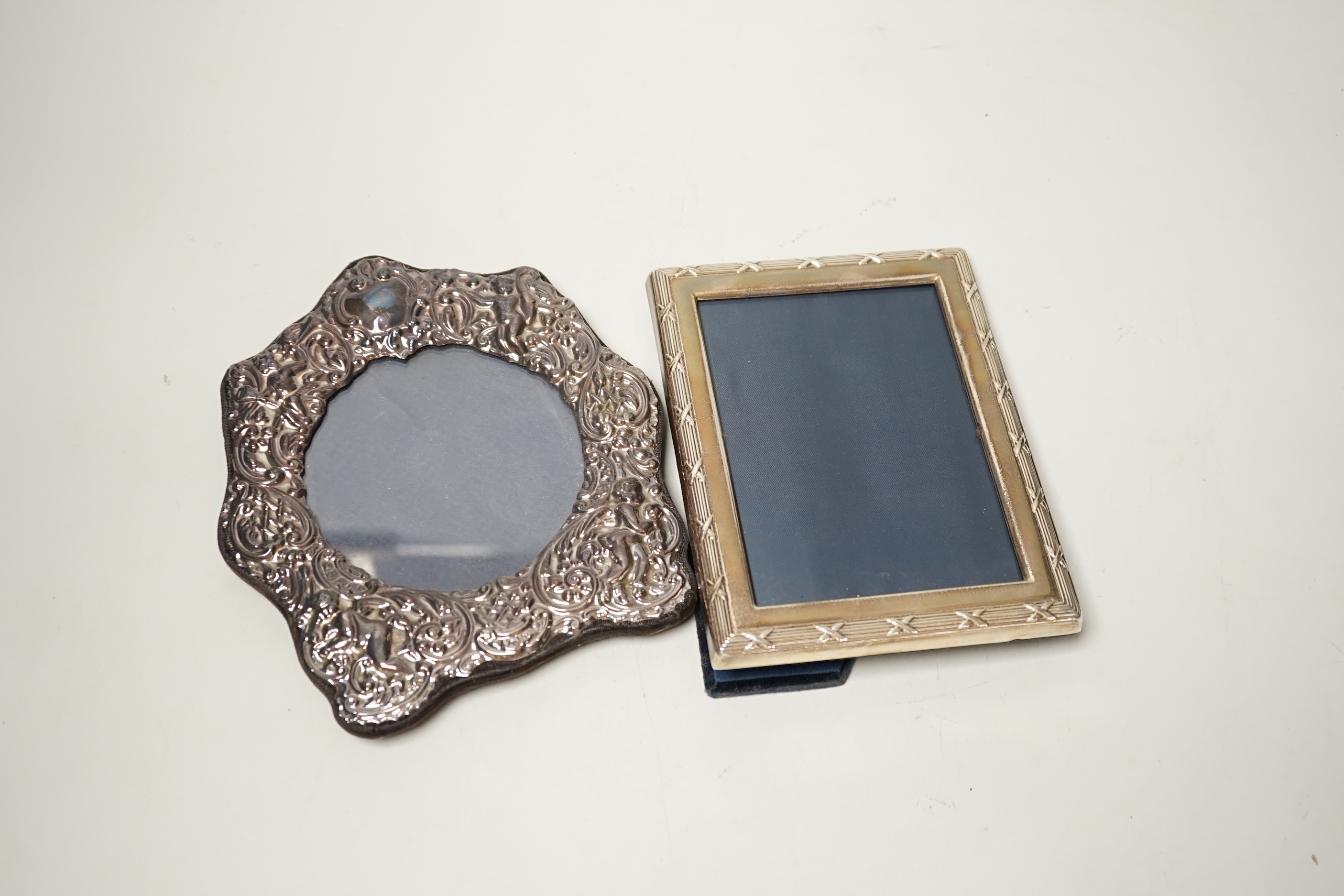 Two modern repousse silver mounted photograph frames, largest 17cm.